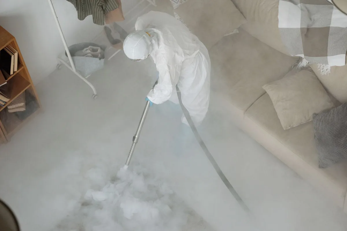 Biohazard cleanup technician in protective equipment, Biscayne Gardens, FL